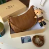شنطه كوتش بني جلد