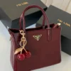 شنطه برادا لمعه عنابي