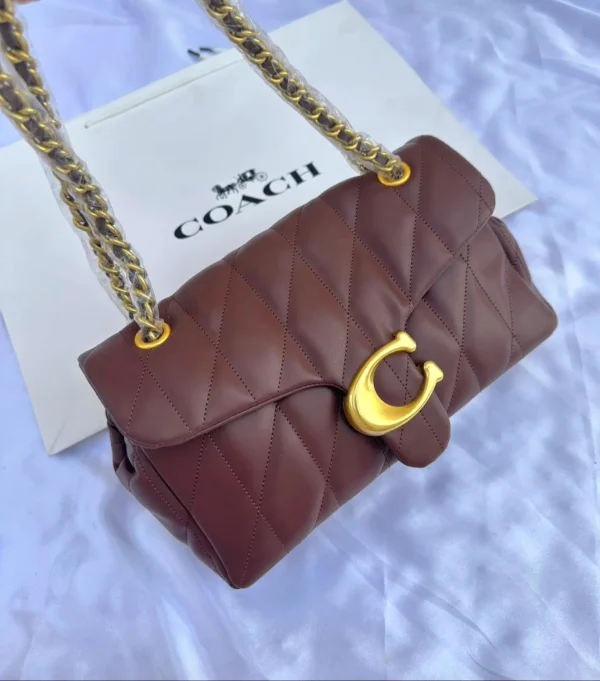شنطه كوتش جلد عنابيه