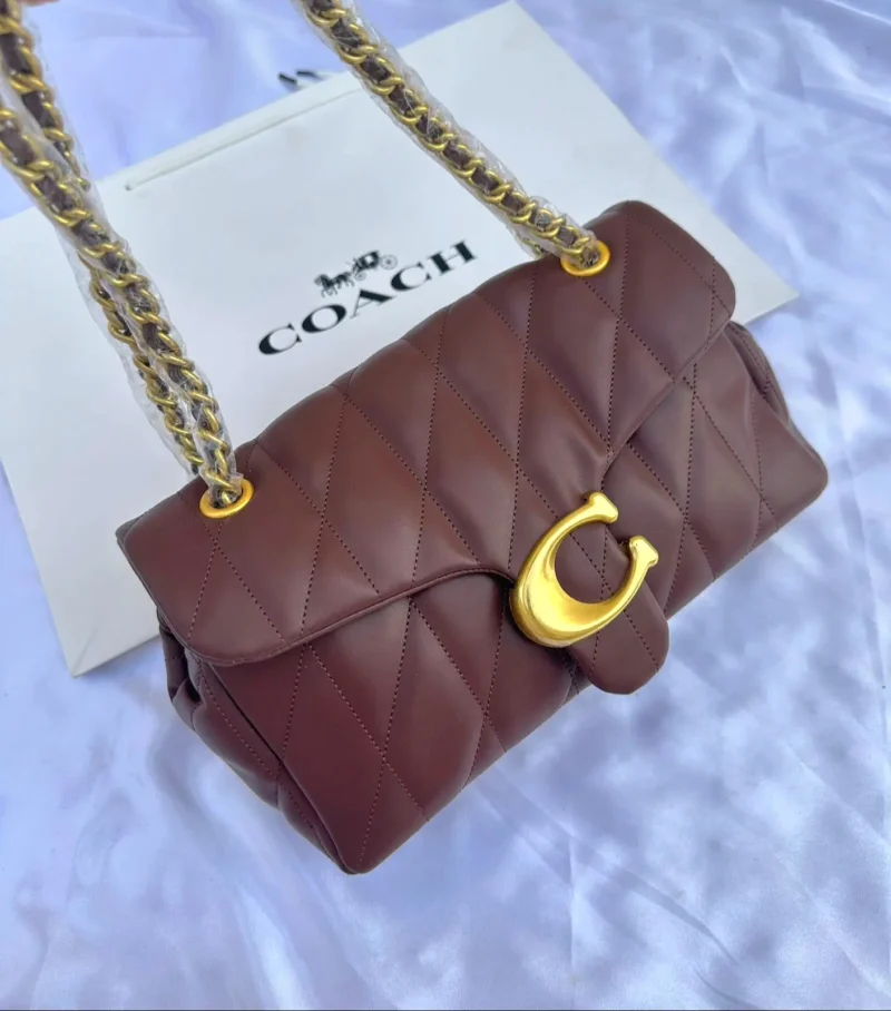 شنطه كوتش جلد عنابيه