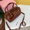 شنطة ميو ميو البنيه