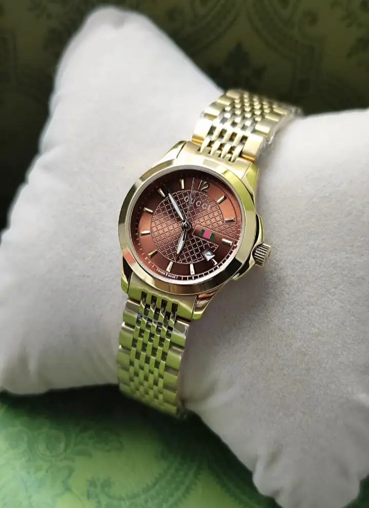 ساعه قوتشي دائريه ذهبي