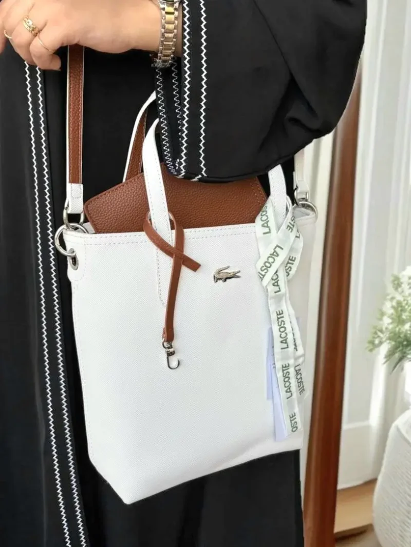 شنطة لاكوست ابيض